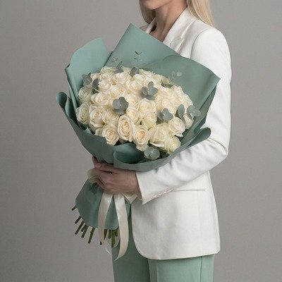 Premium white roses Moscow arrangement named Pure Love by Russia-Flora, featuring thirty-five luxury Avalanche white roses mixed with fresh eucalyptus leaves.